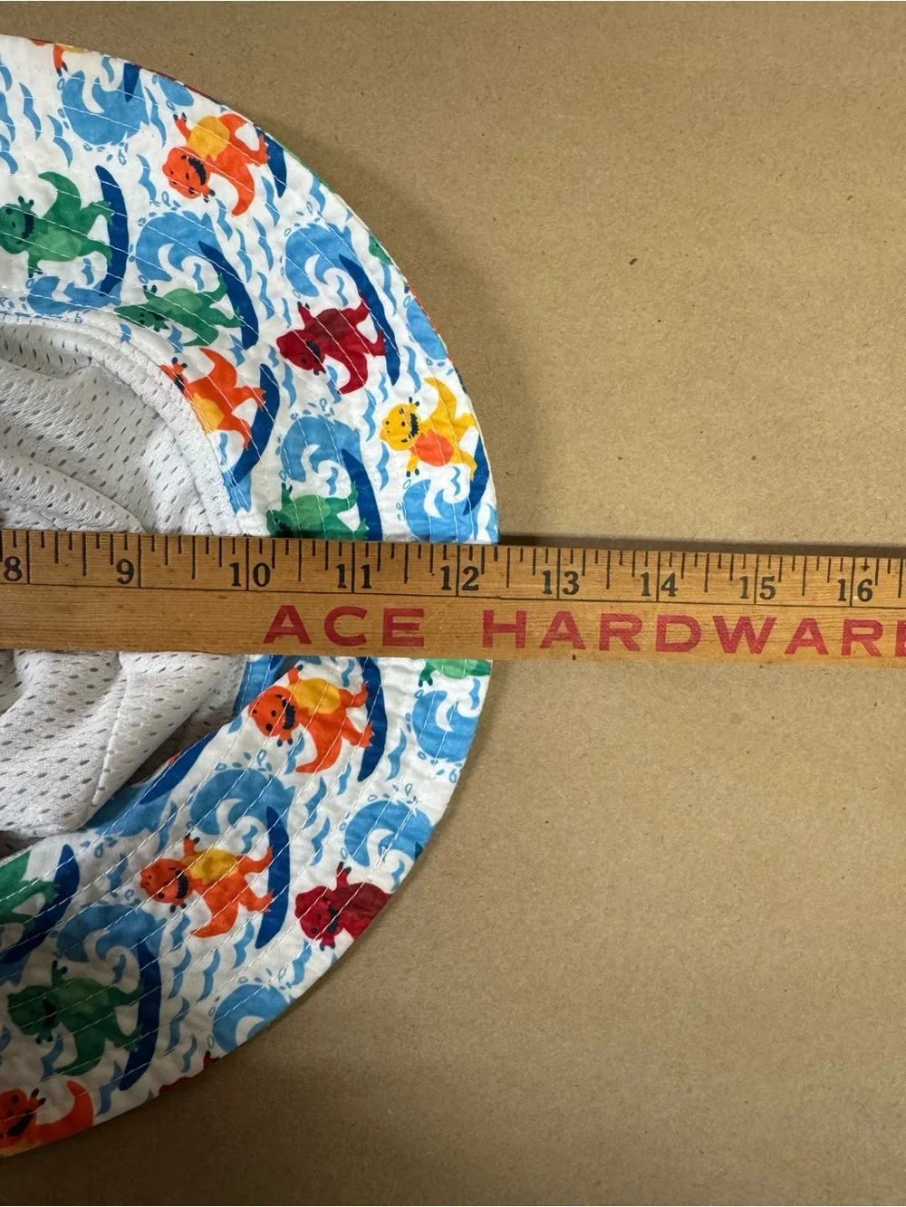 Amazon Kids' White Bucket Hat with Multicolor Surfing Dinosaurs